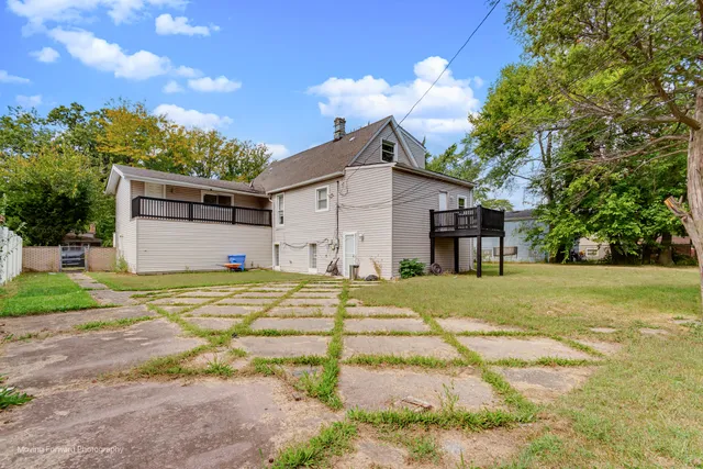 a house view with a backyard space