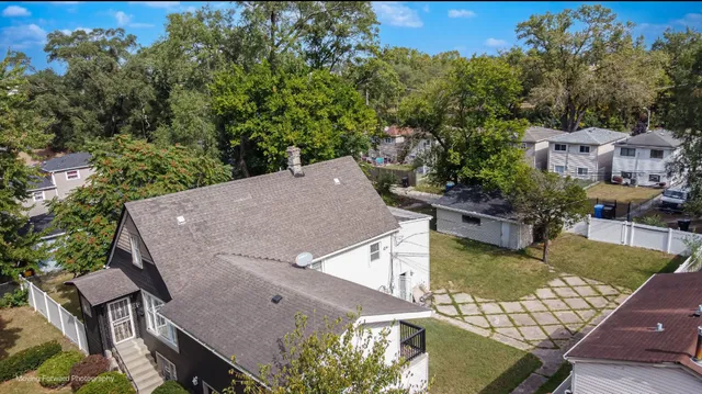swimming pool view with a seating space