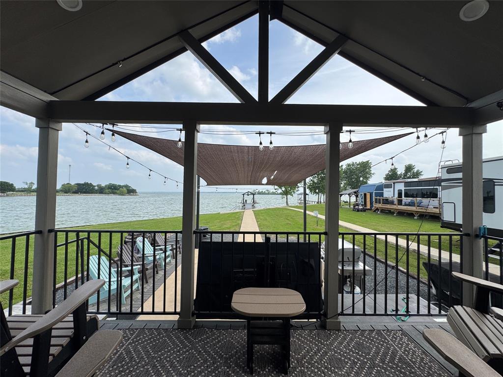 5000 Waterfront Road, Unit 126 Kerens, TX 75144 - Photo 12 of 28 a view of a balcony with a swimming pool