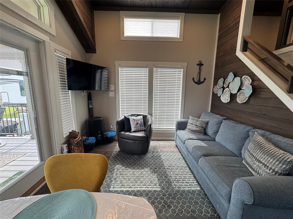 5000 Waterfront Road, Unit 126 Kerens, TX 75144 - Photo 14 of 28 a living room with furniture a flat screen tv and a window