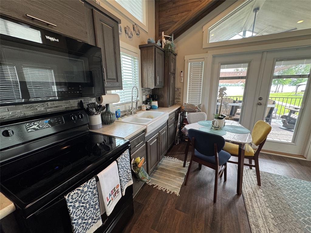 5000 Waterfront Road, Unit 126 Kerens, TX 75144 - Photo 17 of 28 a kitchen with a table chairs and a stove