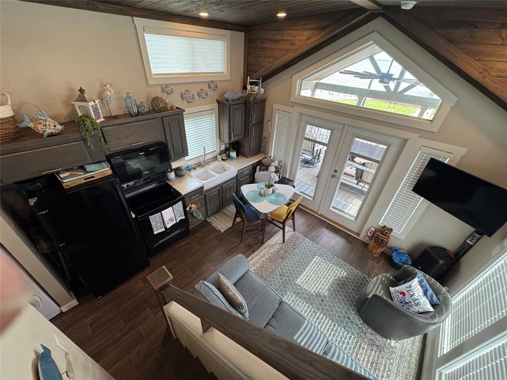 5000 Waterfront Road, Unit 126 Kerens, TX 75144 - Photo 21 of 28 a living room with furniture and a fireplace