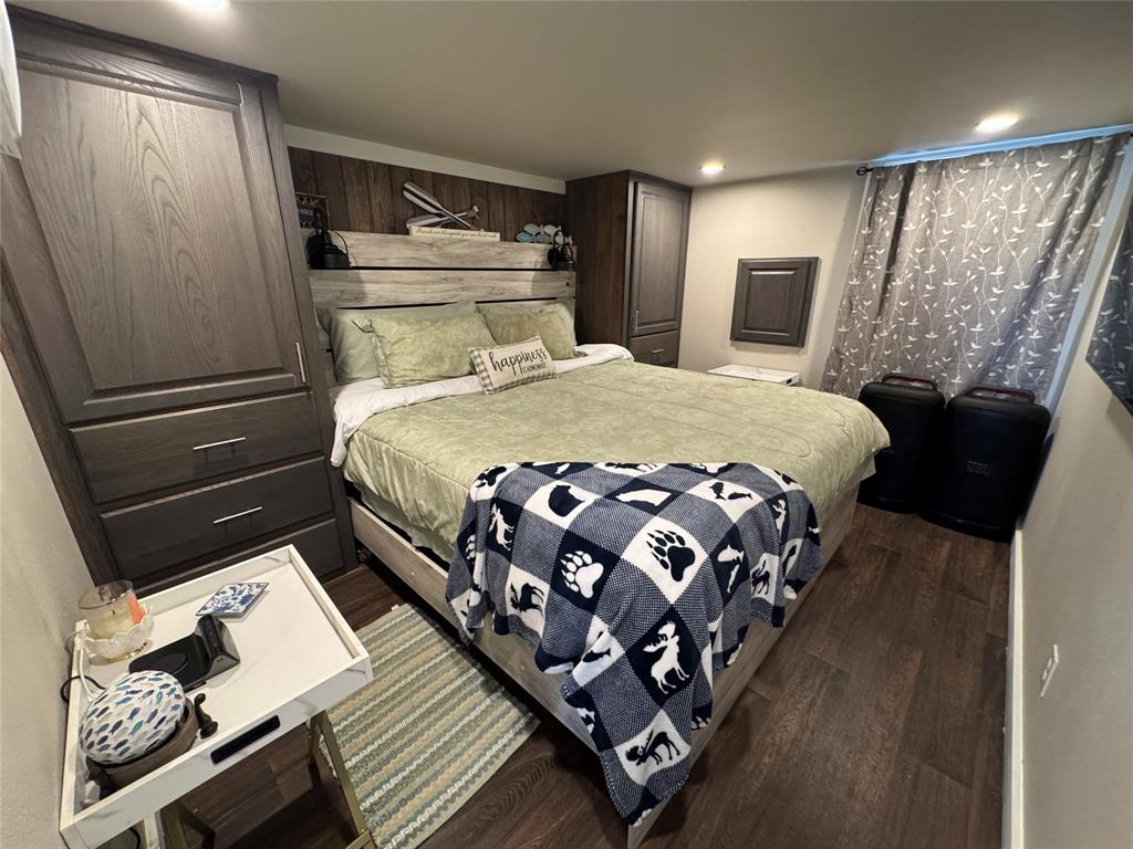 5000 Waterfront Road, Unit 126 Kerens, TX 75144 - Photo 23 of 28 a bedroom with a bed window and mirror