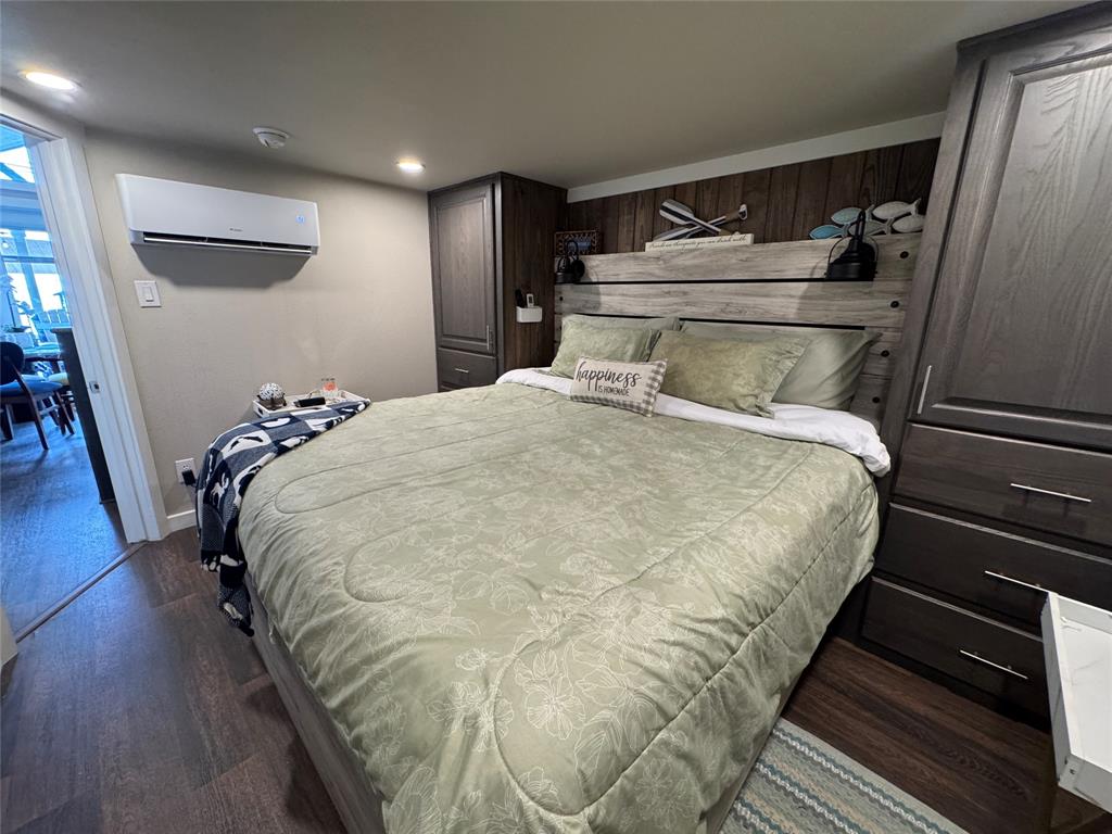 5000 Waterfront Road, Unit 126 Kerens, TX 75144 - Photo 25 of 28 a bed sitting in a bedroom next to a window