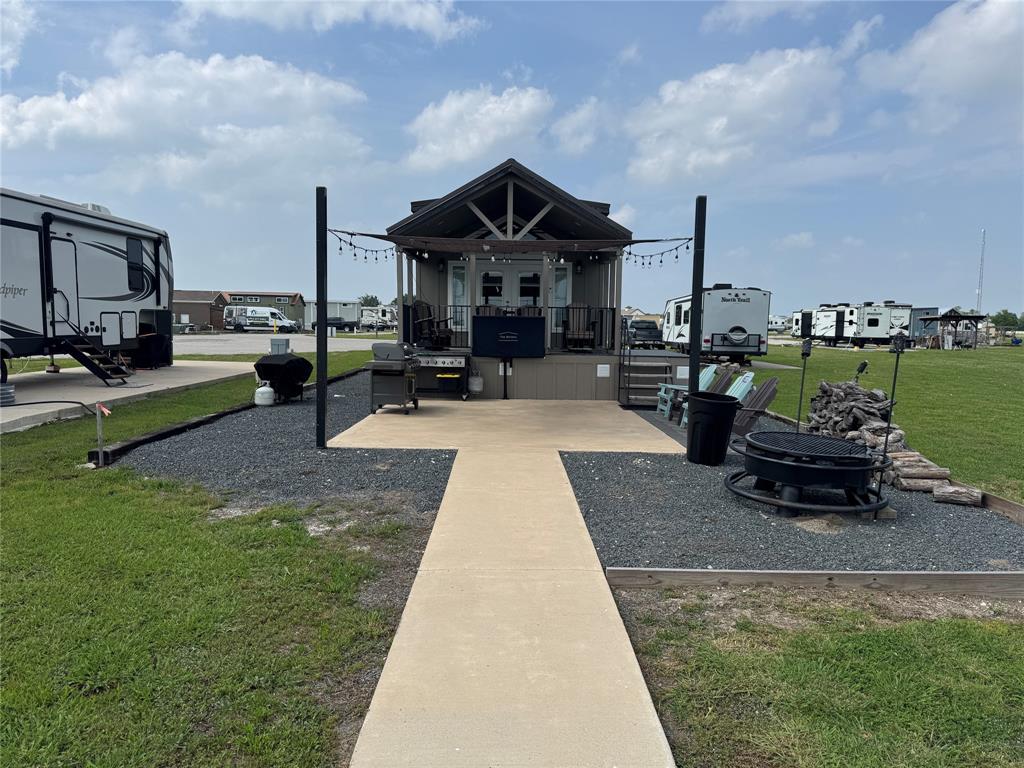 5000 Waterfront Road, Unit 126 Kerens, TX 75144 - Photo 3 of 28 a view of a house with sitting area and couches in the patio