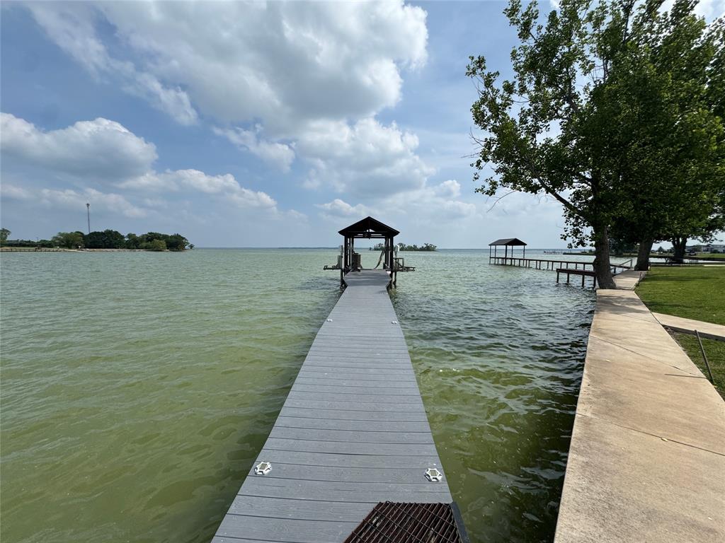 5000 Waterfront Road, Unit 126 Kerens, TX 75144 - Photo 4 of 28 a view of a lake with a large trees