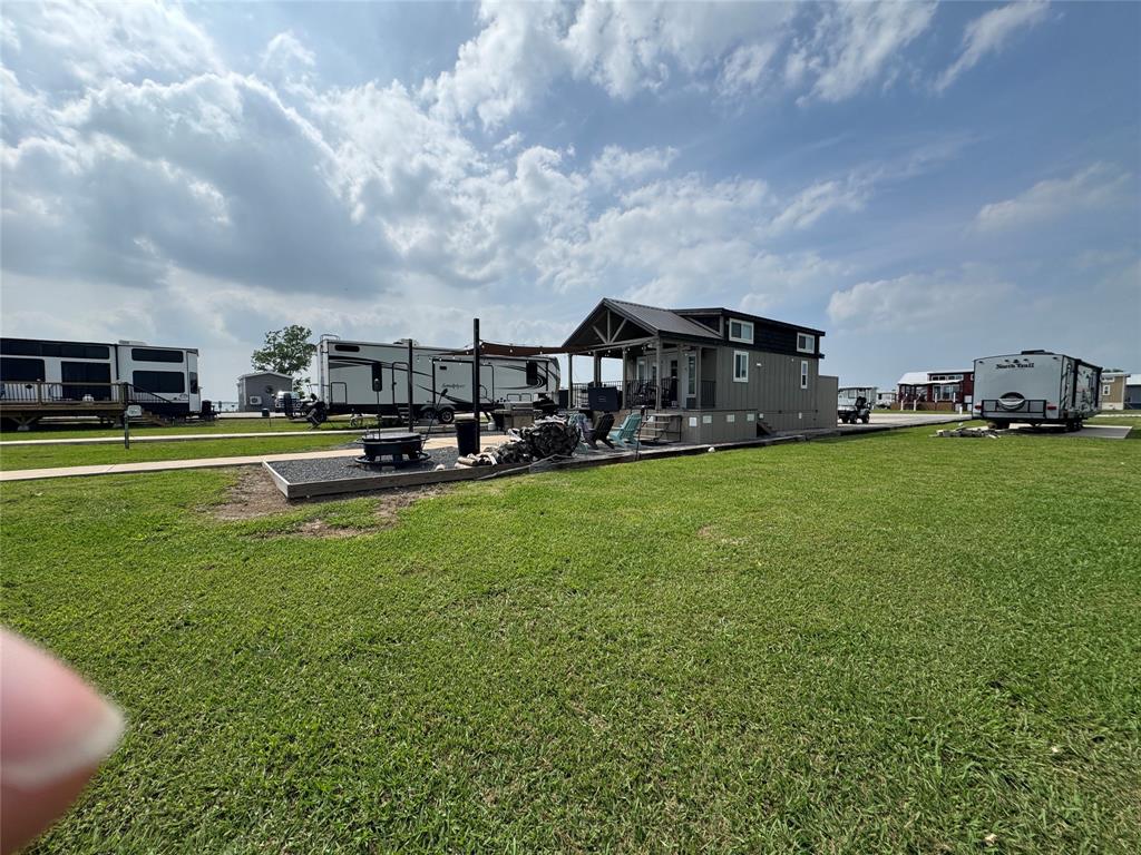 5000 Waterfront Road, Unit 126 Kerens, TX 75144 - Photo 5 of 28 a view of a big room with of a big yard and large trees