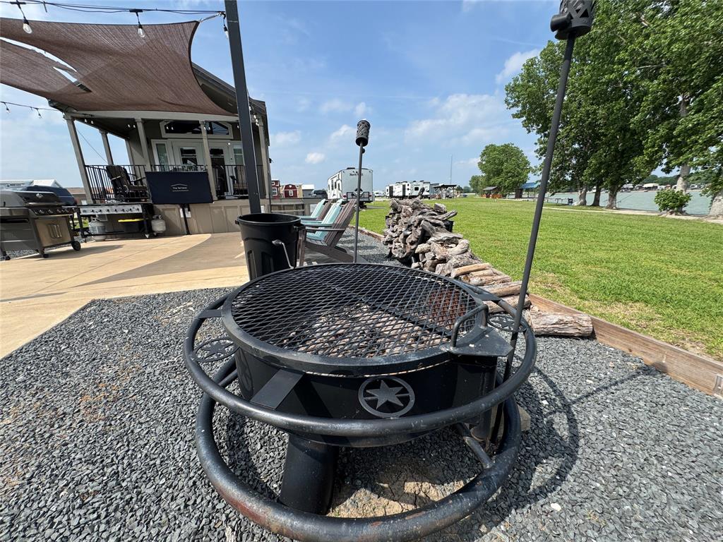 5000 Waterfront Road, Unit 126 Kerens, TX 75144 - Photo 7 of 28 a view of a swimming pool with a patio and a garden