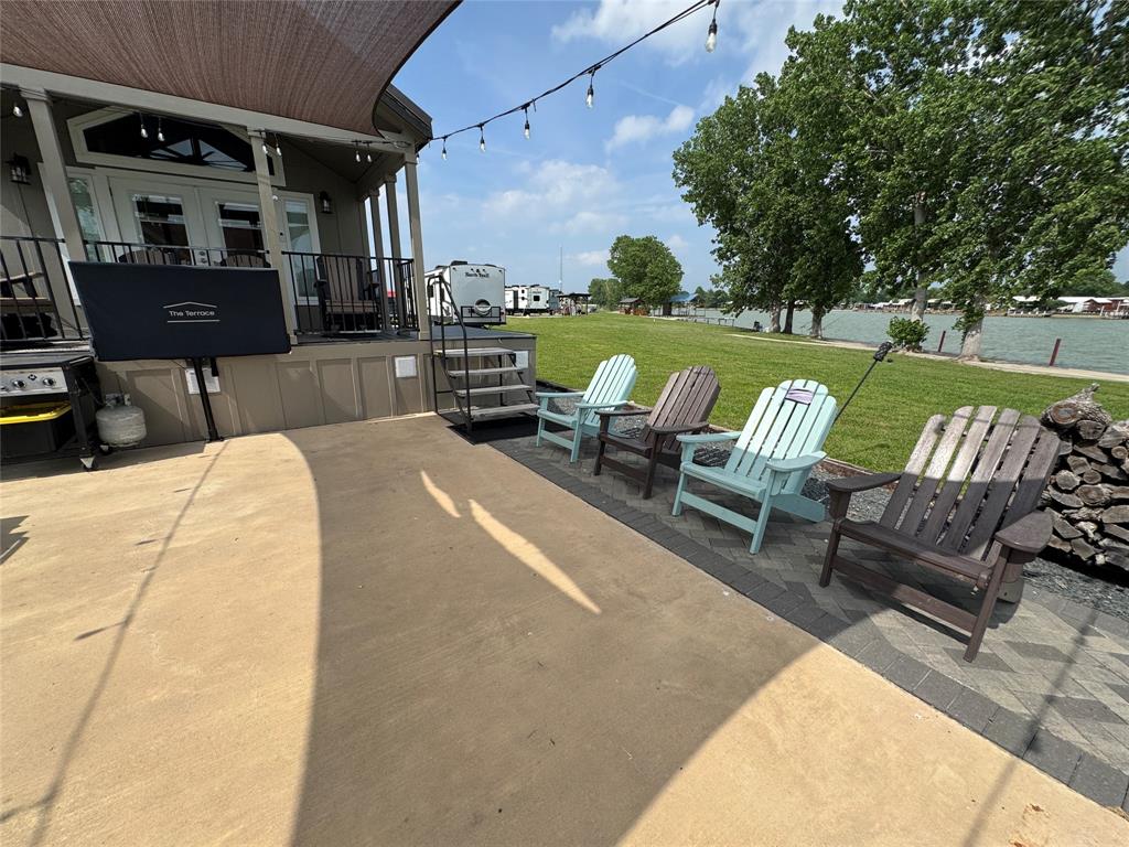 5000 Waterfront Road, Unit 126 Kerens, TX 75144 - Photo 9 of 28 a view of swimming pool with outdoor seating and plants
