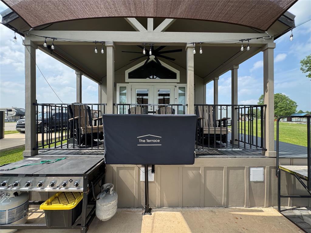 5000 Waterfront Road, Unit 126 Kerens, TX 75144 - Photo 10 of 28 a view of roof deck with a table and chairs
