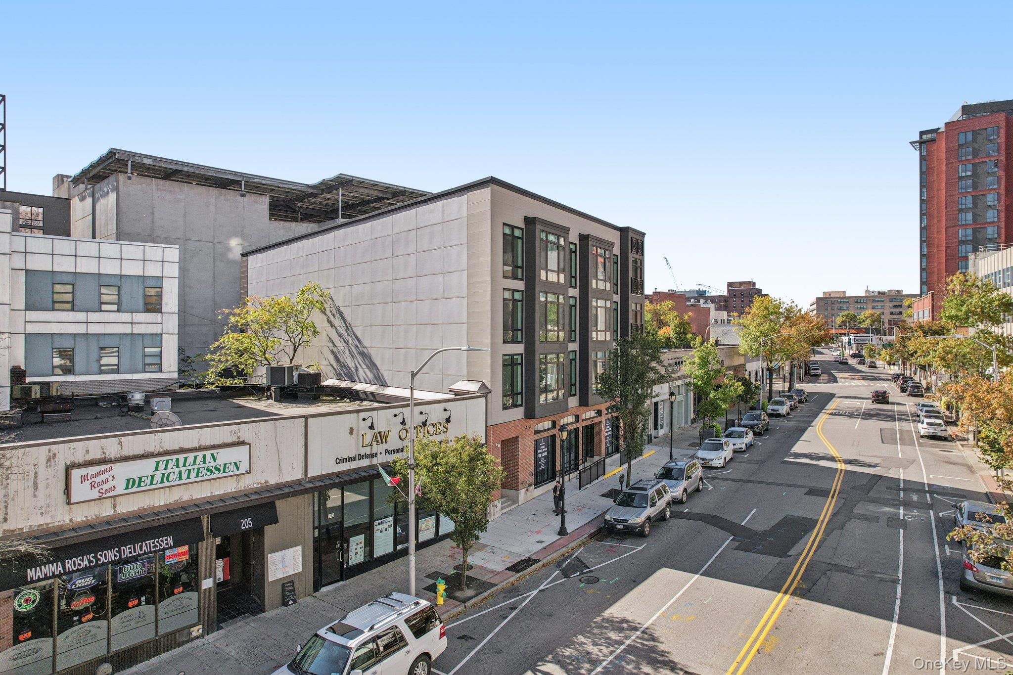 199 East Post Road, Unit 204 White Plains, NY 10601 - Photo 18 of 21 a street view with tall buildings