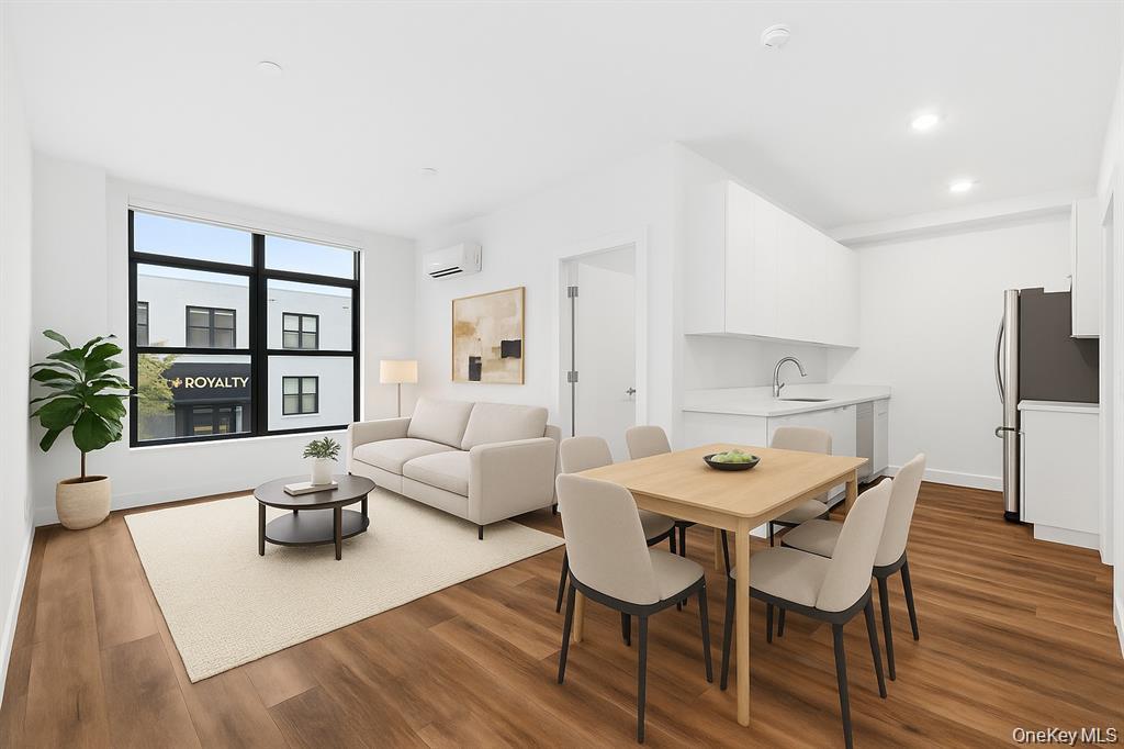 199 East Post Road, Unit 204 White Plains, NY 10601 - Photo 2 of 21 a view of a dining room with furniture and wooden floor