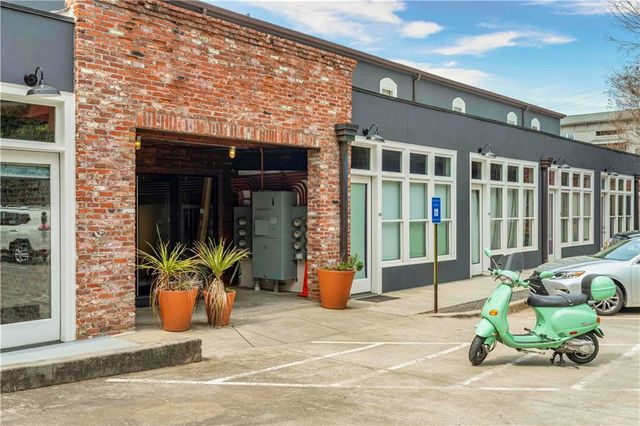 a front view of a house with outdoor seating