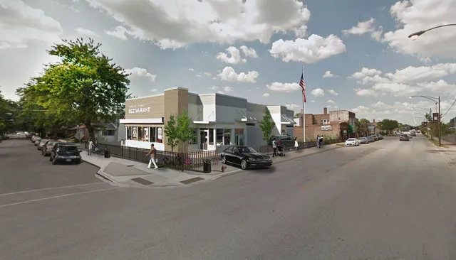 a view of a street with cars