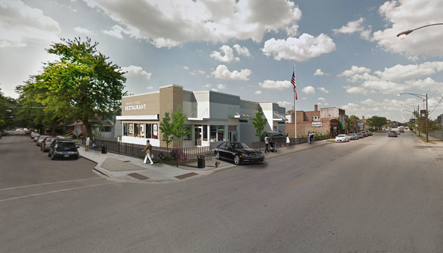 a view of a street with cars