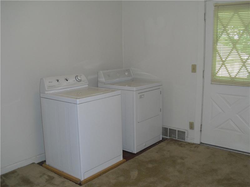 1962 Savannah Road New Castle, PA 16101 - Photo 7 of 7 Bedroom. This bedroom is currently set up for the laundry room but could be easily turned back into a bedroom.