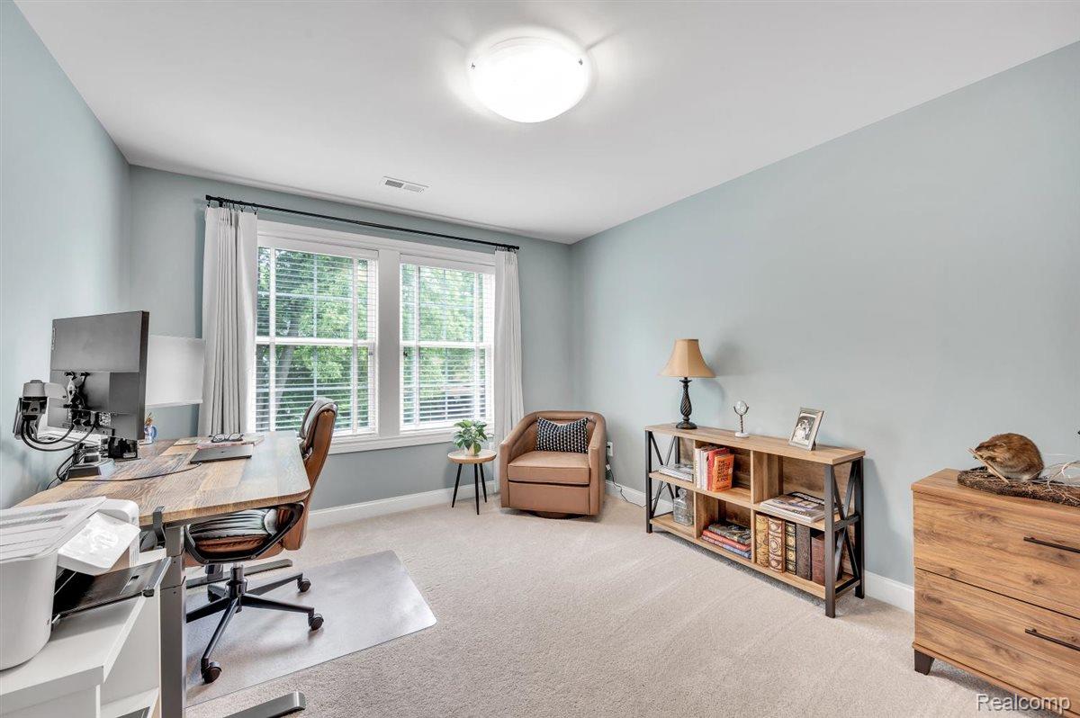 142 Griggs Street Rochester, MI 48307 - Photo 29 of 51 Room featuring light blue walls and neutral carpeting