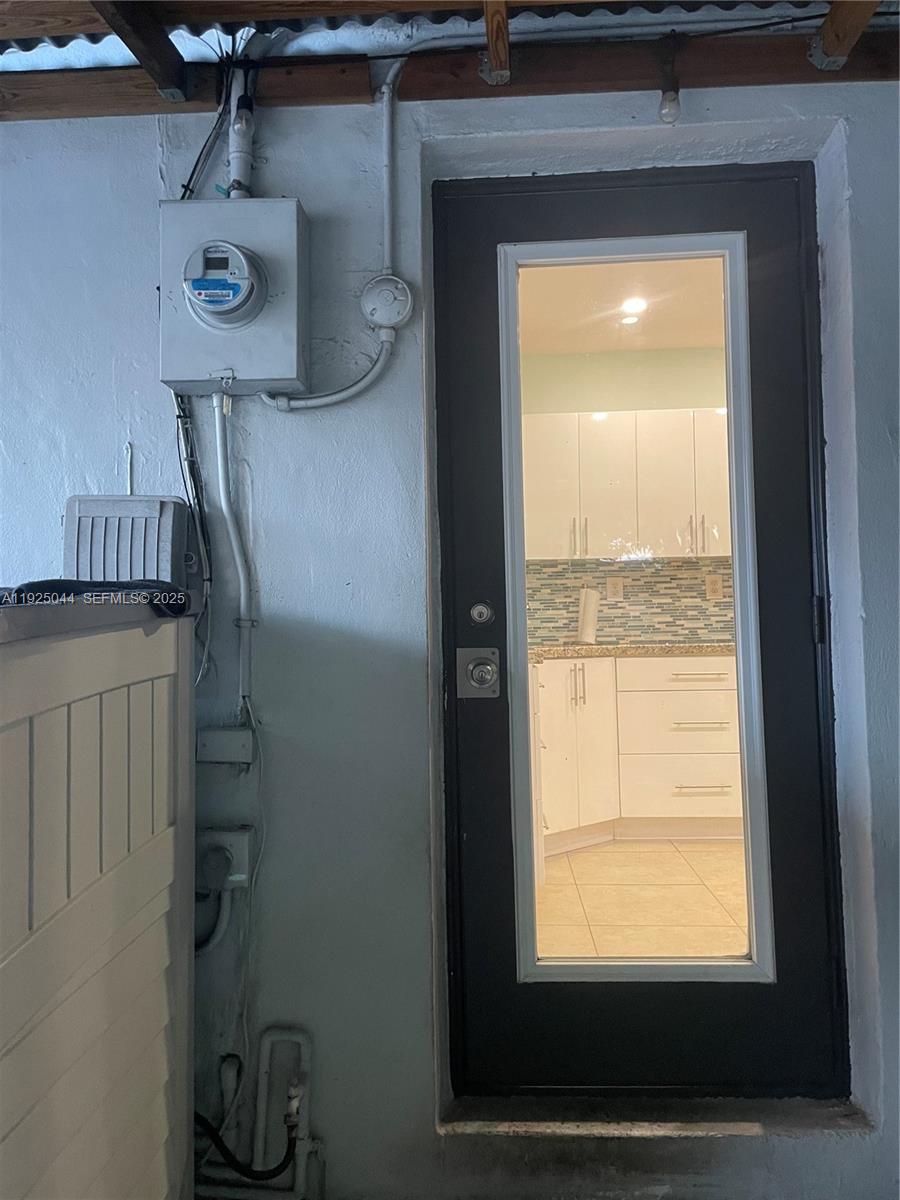 705 East 9th Court Hialeah, FL 33010 - Photo 34 of 36 a view of a storage and utility room with a window