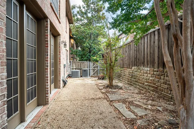 a view of a backyard with a tree