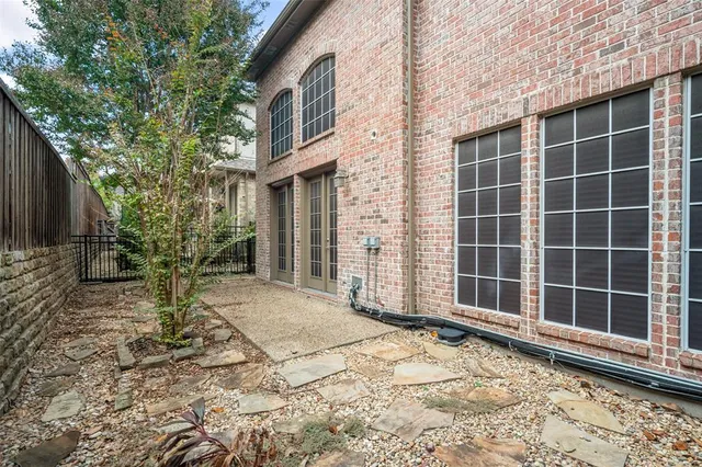 a view of a house with a yard and porch