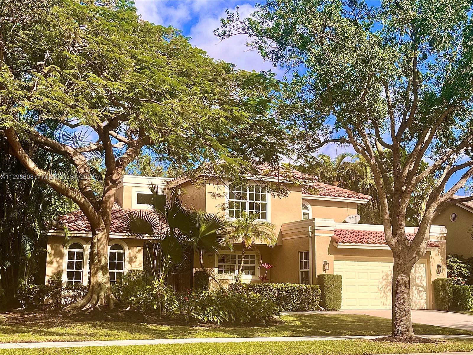 2875 Northwest 28th Street Boca Raton, FL 33434 - Photo 1 of 32 a front view of a residential apartment building with a yard