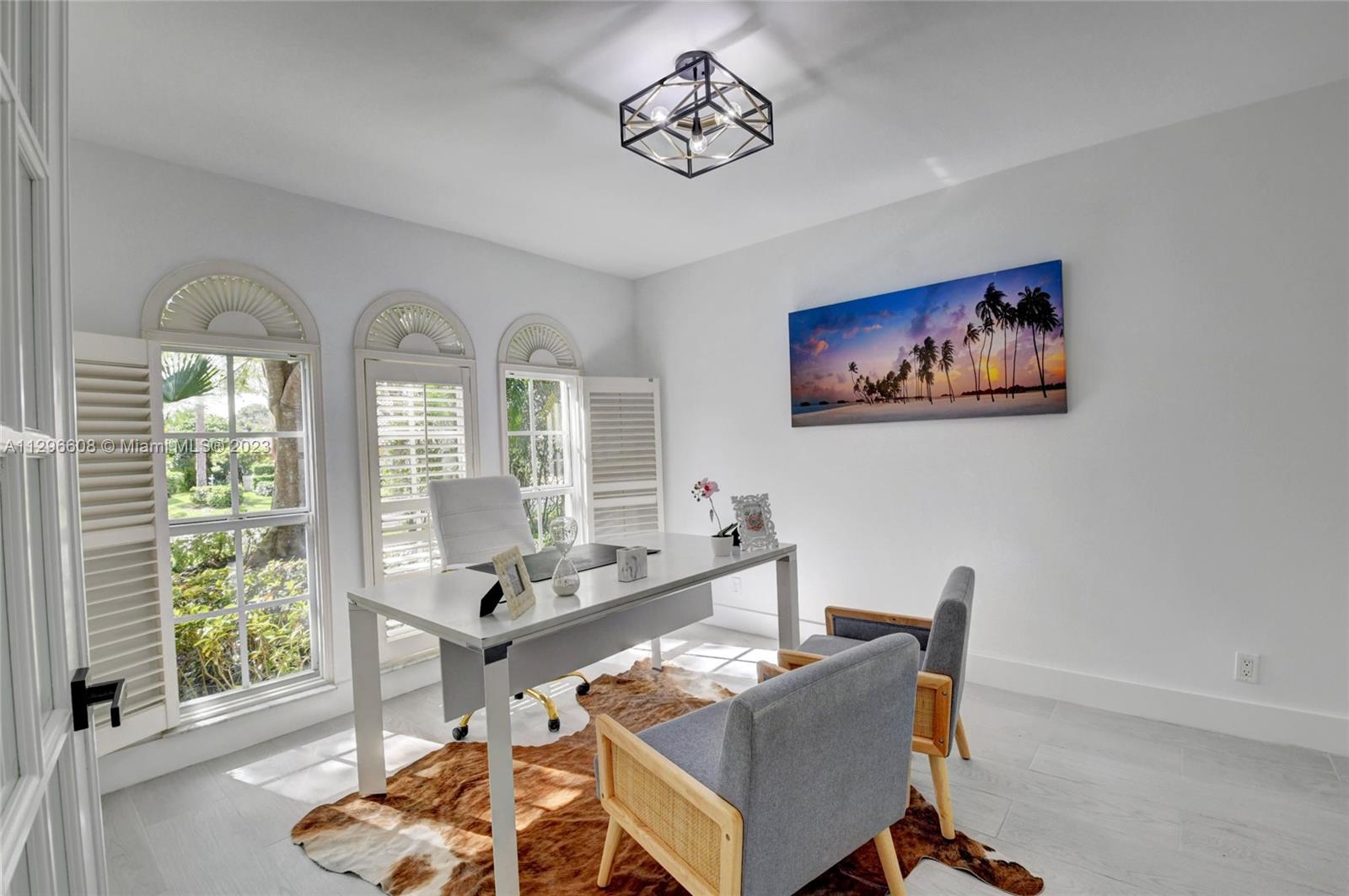 2875 Northwest 28th Street Boca Raton, FL 33434 - Photo 11 of 32 a living room with furniture and a large window