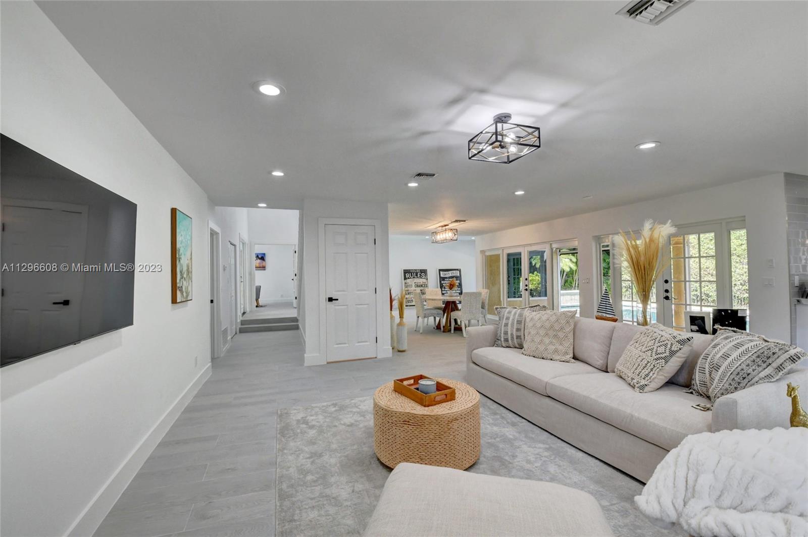 2875 Northwest 28th Street Boca Raton, FL 33434 - Photo 13 of 32 a living room with furniture and a large window
