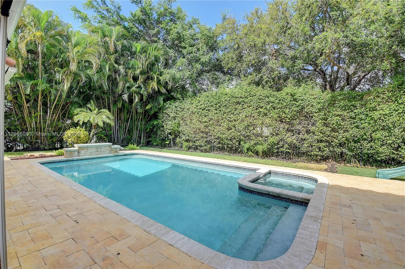 2875 Northwest 28th Street Boca Raton, FL 33434 - Photo 17 of 32 a view of swimming pool from a yard