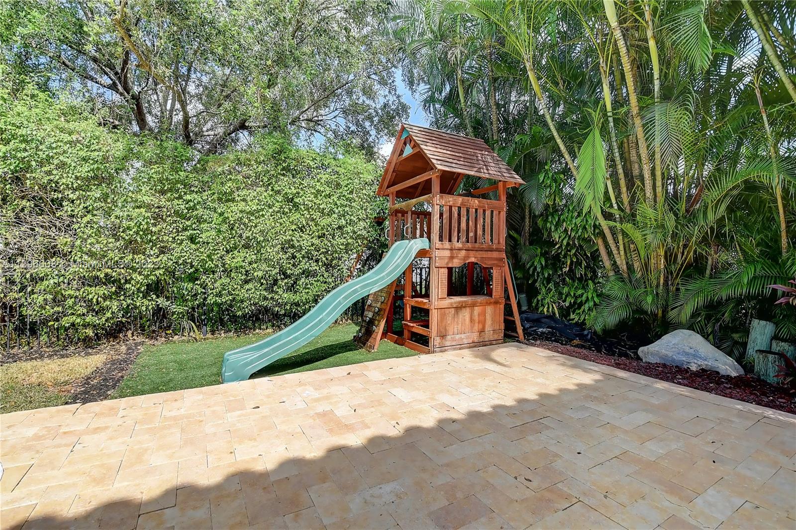2875 Northwest 28th Street Boca Raton, FL 33434 - Photo 23 of 32 a view of wooden deck with a trees