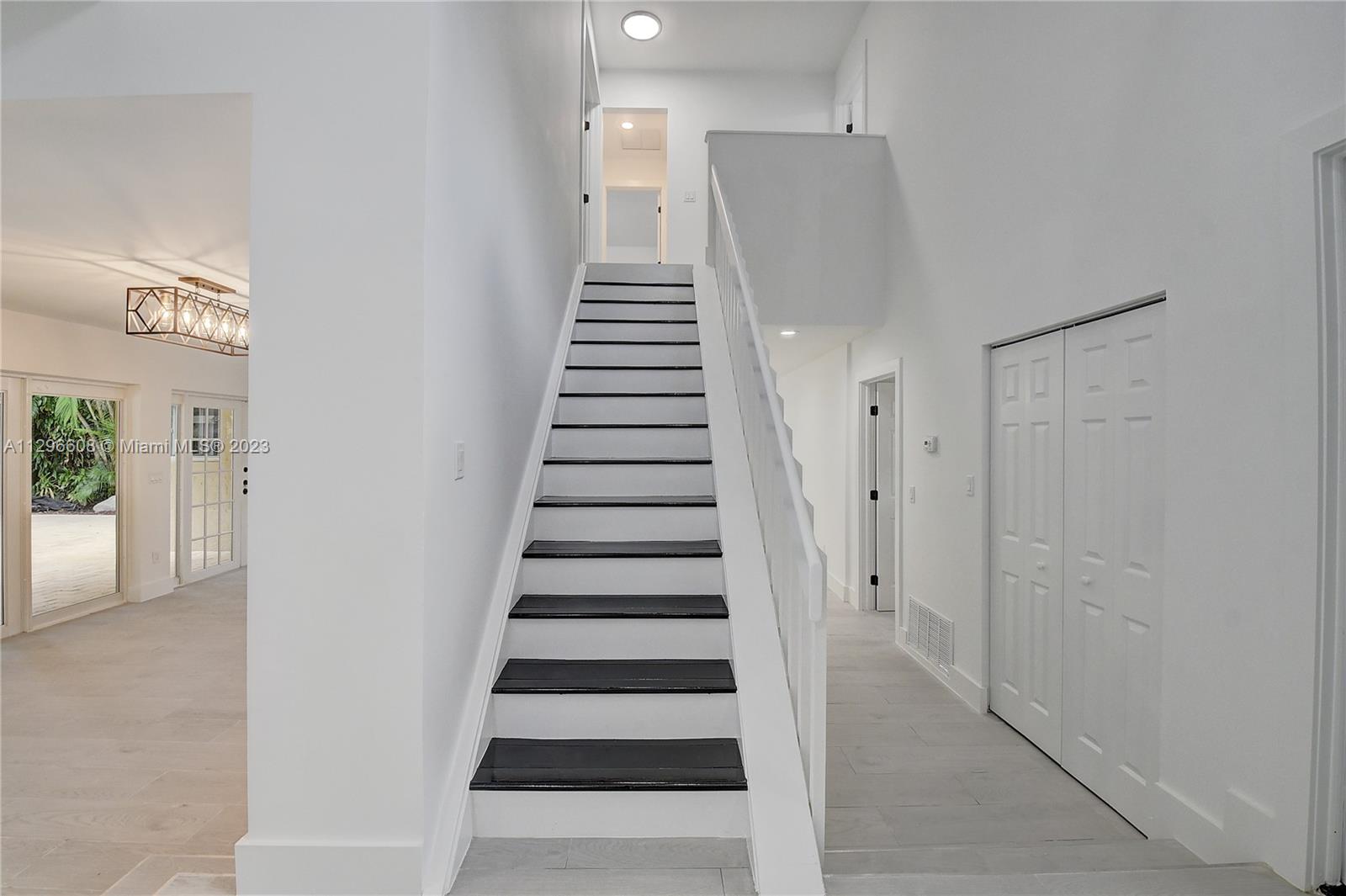 2875 Northwest 28th Street Boca Raton, FL 33434 - Photo 24 of 32 a view of entryway with furniture and wooden floor