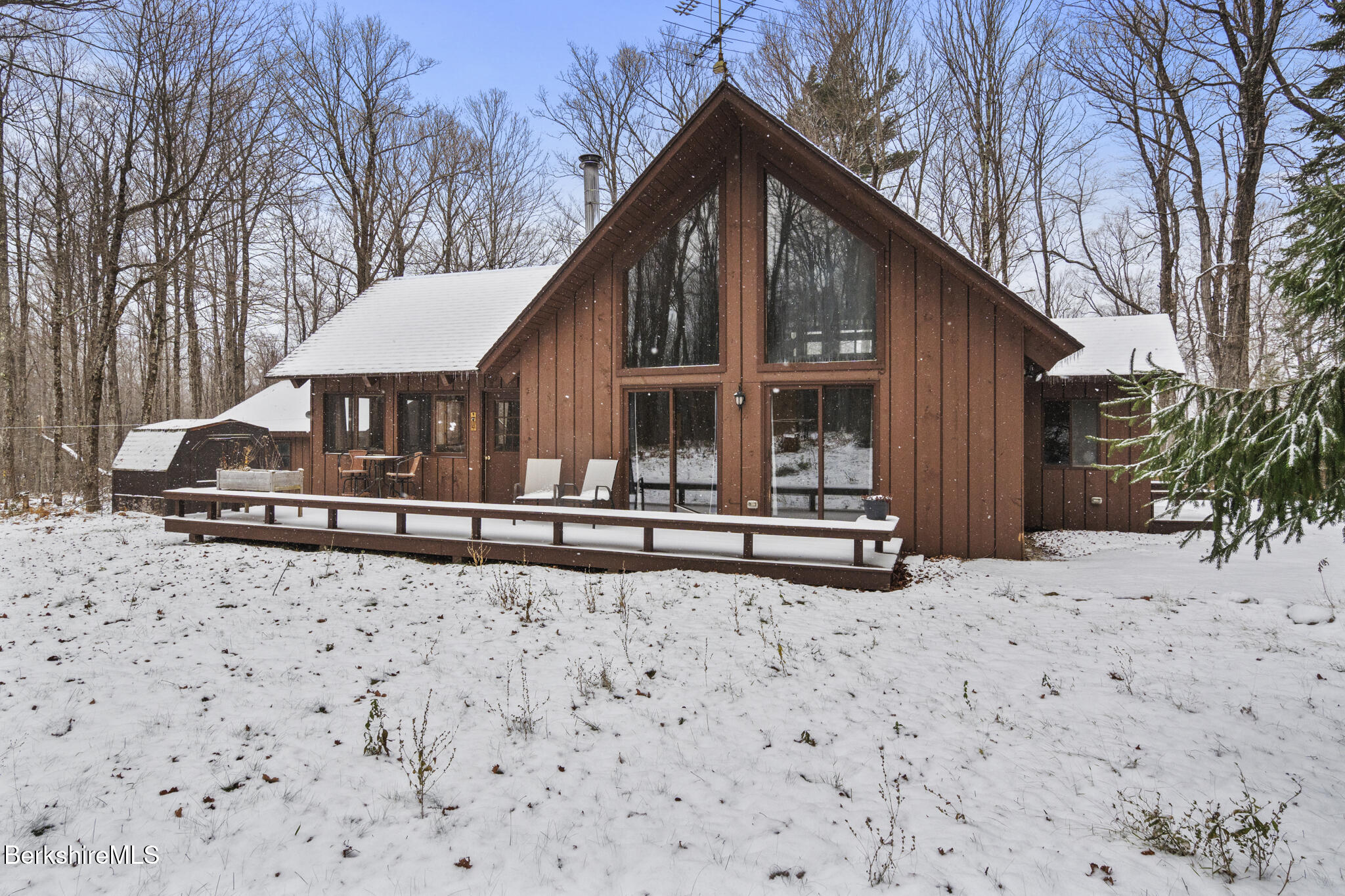 a house with trees in the background