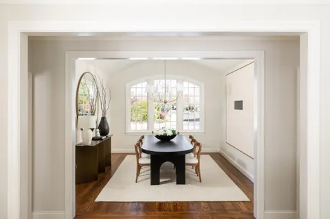 a view of a livingroom with furniture window and wooden floor