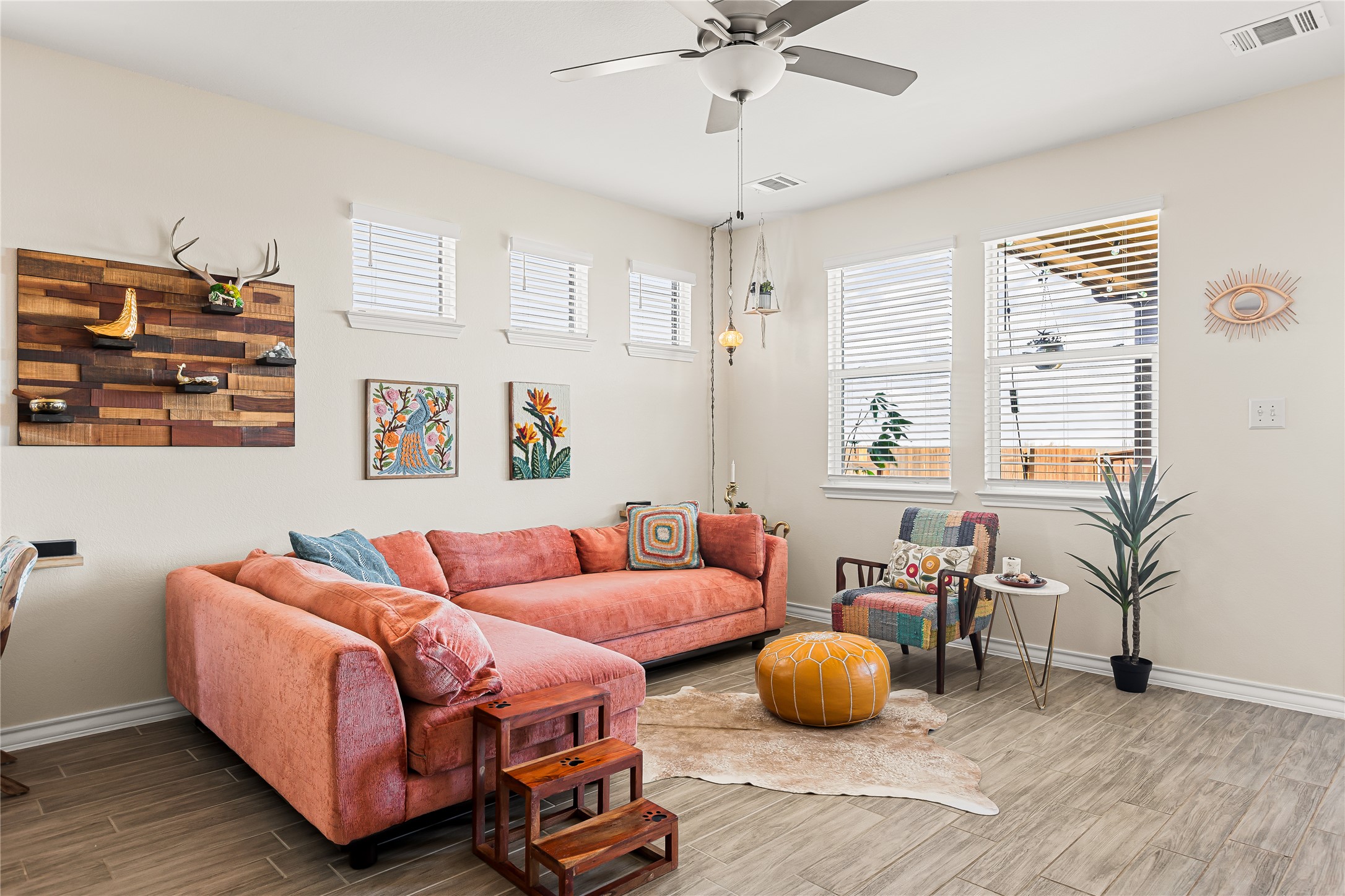 862 Pepperbark Loop Buda, TX 78610 - Photo 12 of 40 a living room with furniture and a chandelier