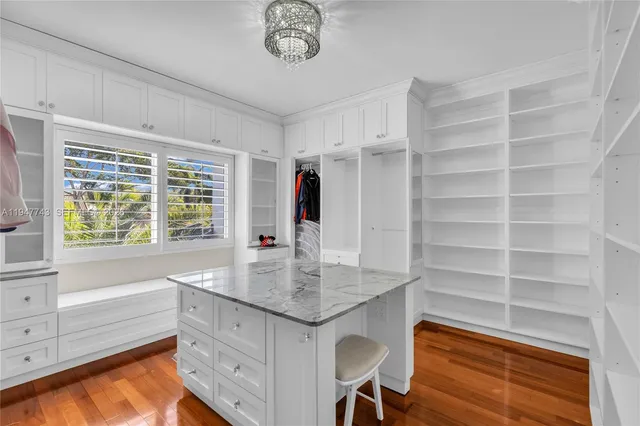 a bathroom with a toilet a sink and a mirror