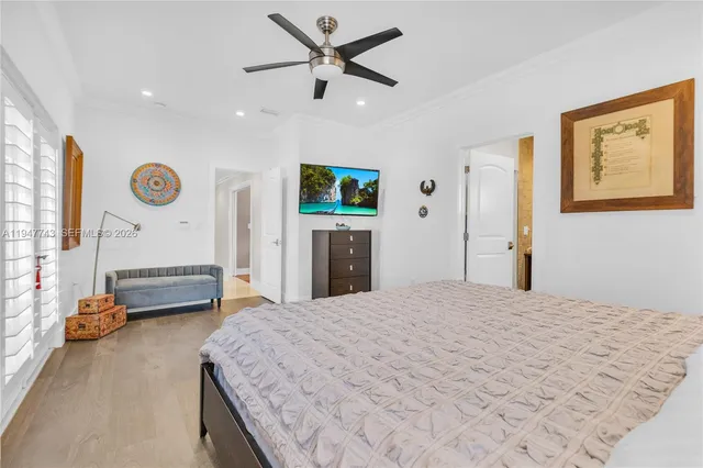 a view of a patio with a table and chairs under an umbrella