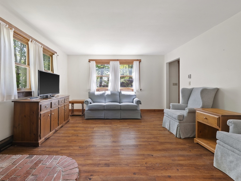 9 Highview Road Rockport, MA 01966 - Photo 8 of 40 a living room with furniture and a flat screen tv