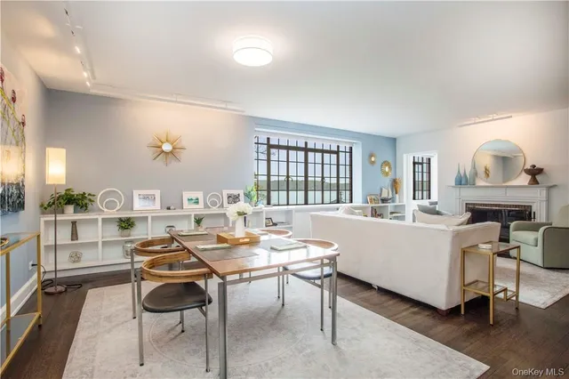 a living room with furniture a window and a table