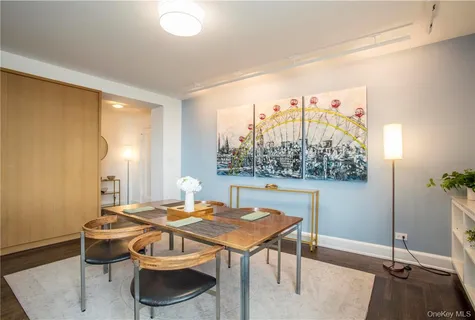 a view of a dining room with furniture and window
