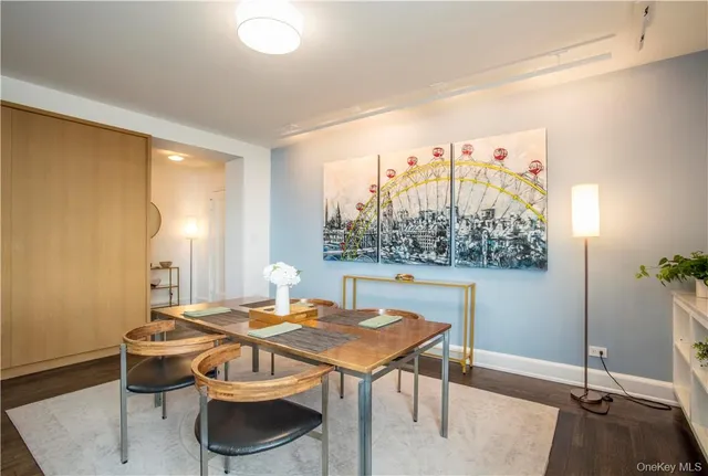 a view of a dining room with furniture and window