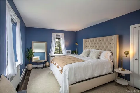 a bedroom with a bed and furniture