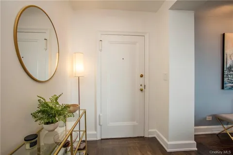 wooden floor with a potted plant on a dresser