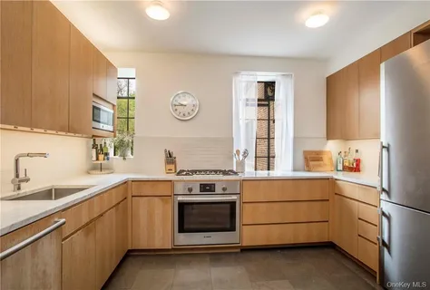 a kitchen with a stove oven and sink