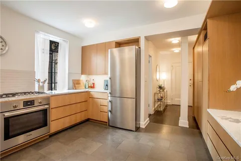 a kitchen with a stove a refrigerator and a stove