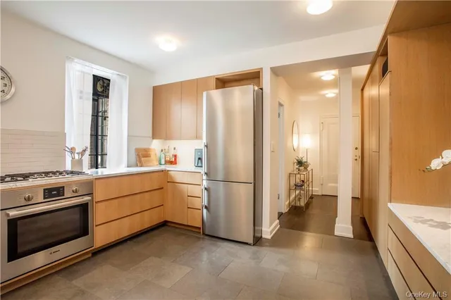 a kitchen with a stove a refrigerator and a stove