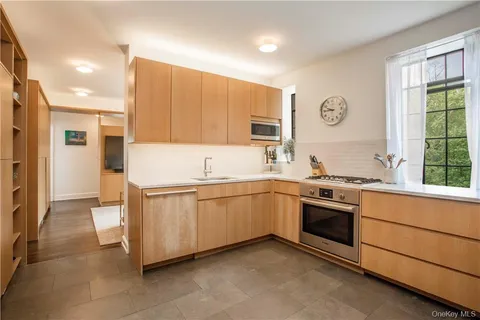 a kitchen with stainless steel appliances granite countertop a stove and a sink