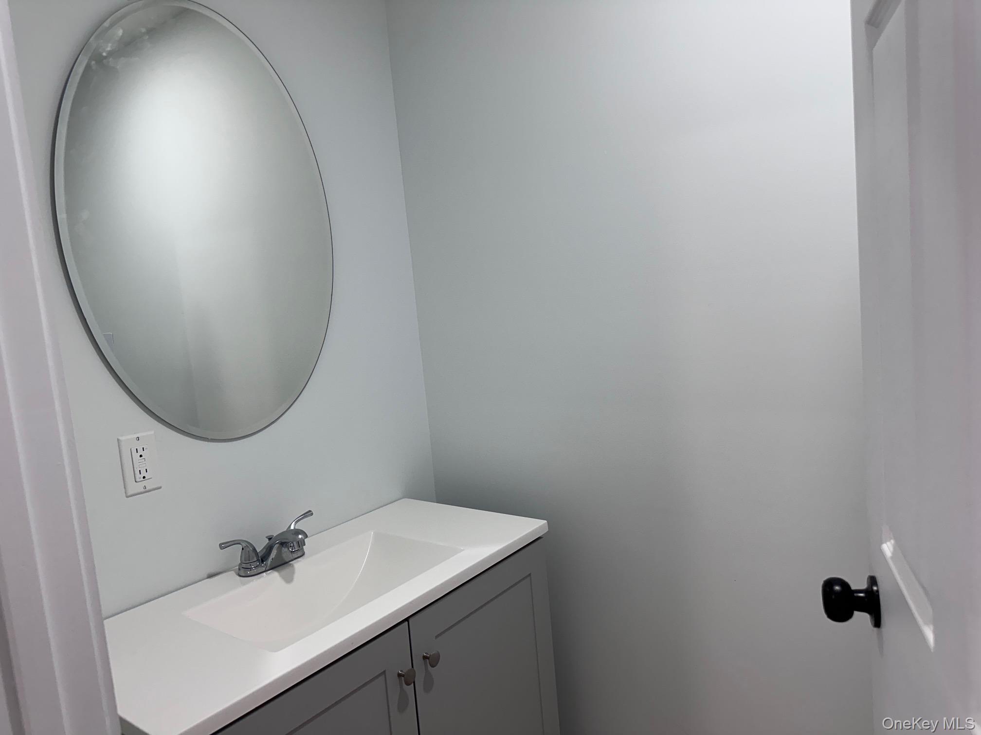 525 Mill Brook Drive Esopus, NY 12466 - Photo 9 of 17 a bathroom with a sink and a mirror