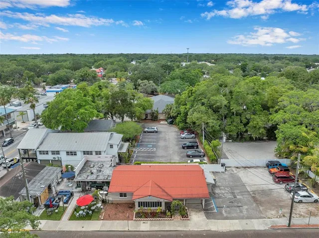 an aerial view of house with yard