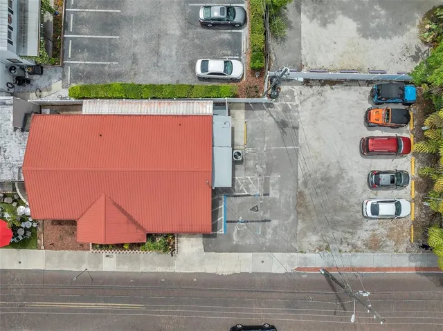 a view of a house with a patio and a yard