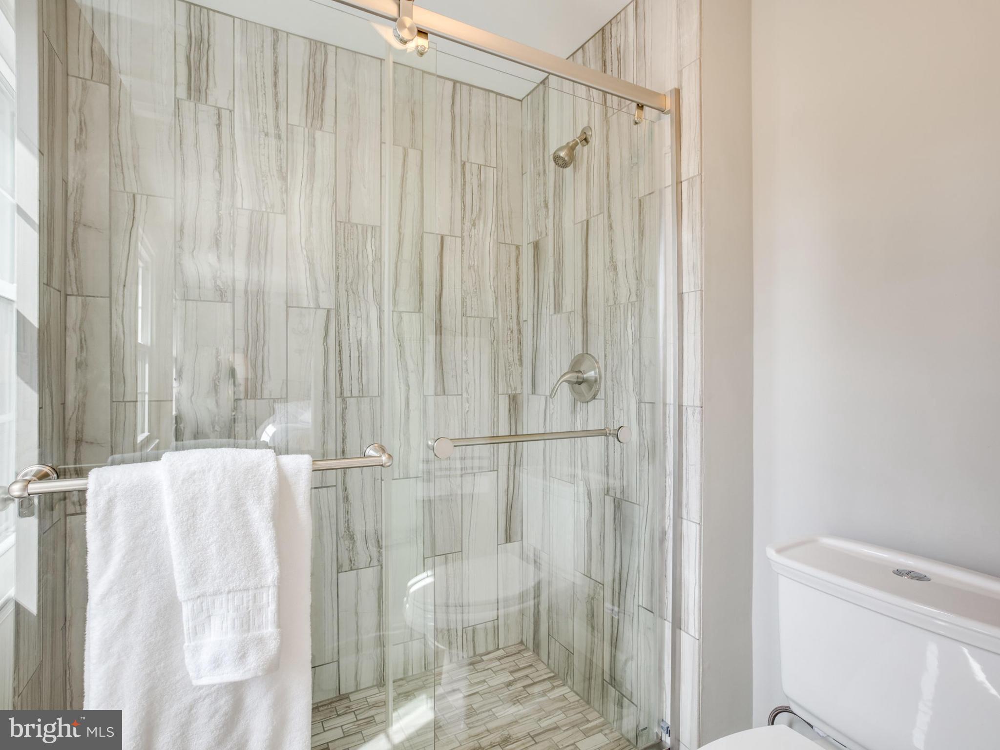 6502 Shipyard Place Falls Church, VA 22043 - Photo 15 of 30 a bathroom with a shower and a tub