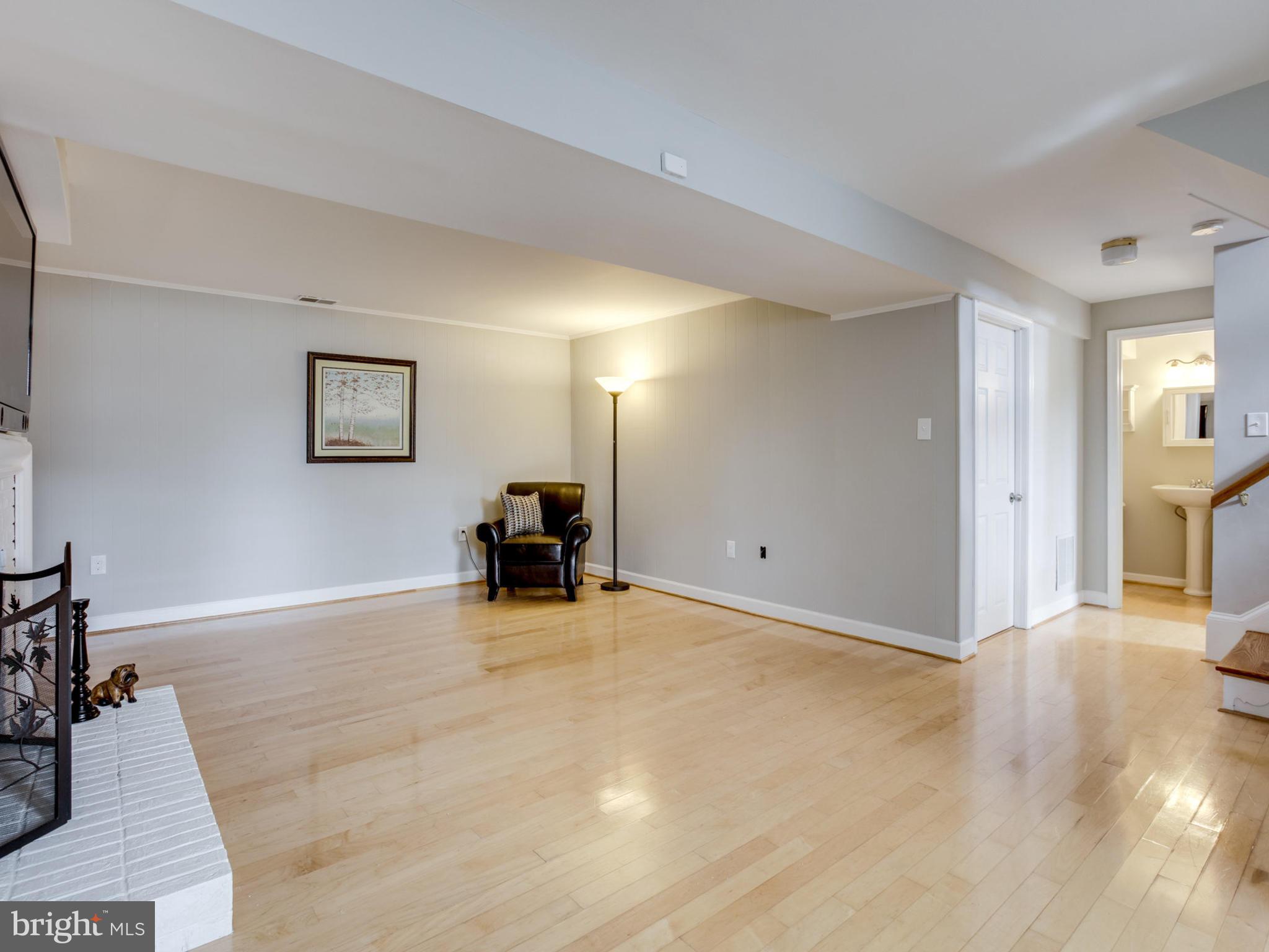 6502 Shipyard Place Falls Church, VA 22043 - Photo 21 of 30 a view of a livingroom with a piano and wooden floor